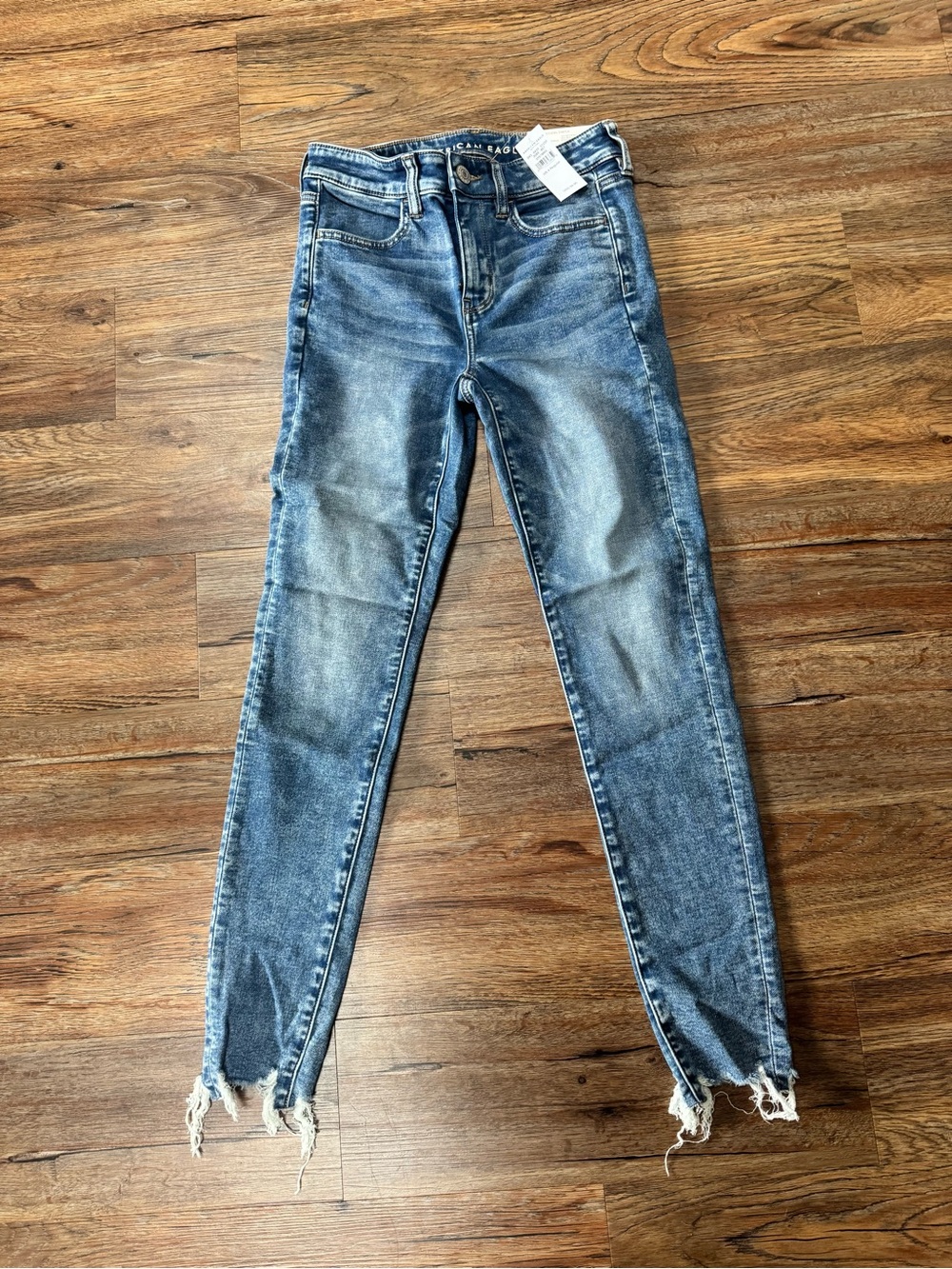 American Eagle Outfitters Women's Faded Blue Skinny Jeans with Frayed Hem